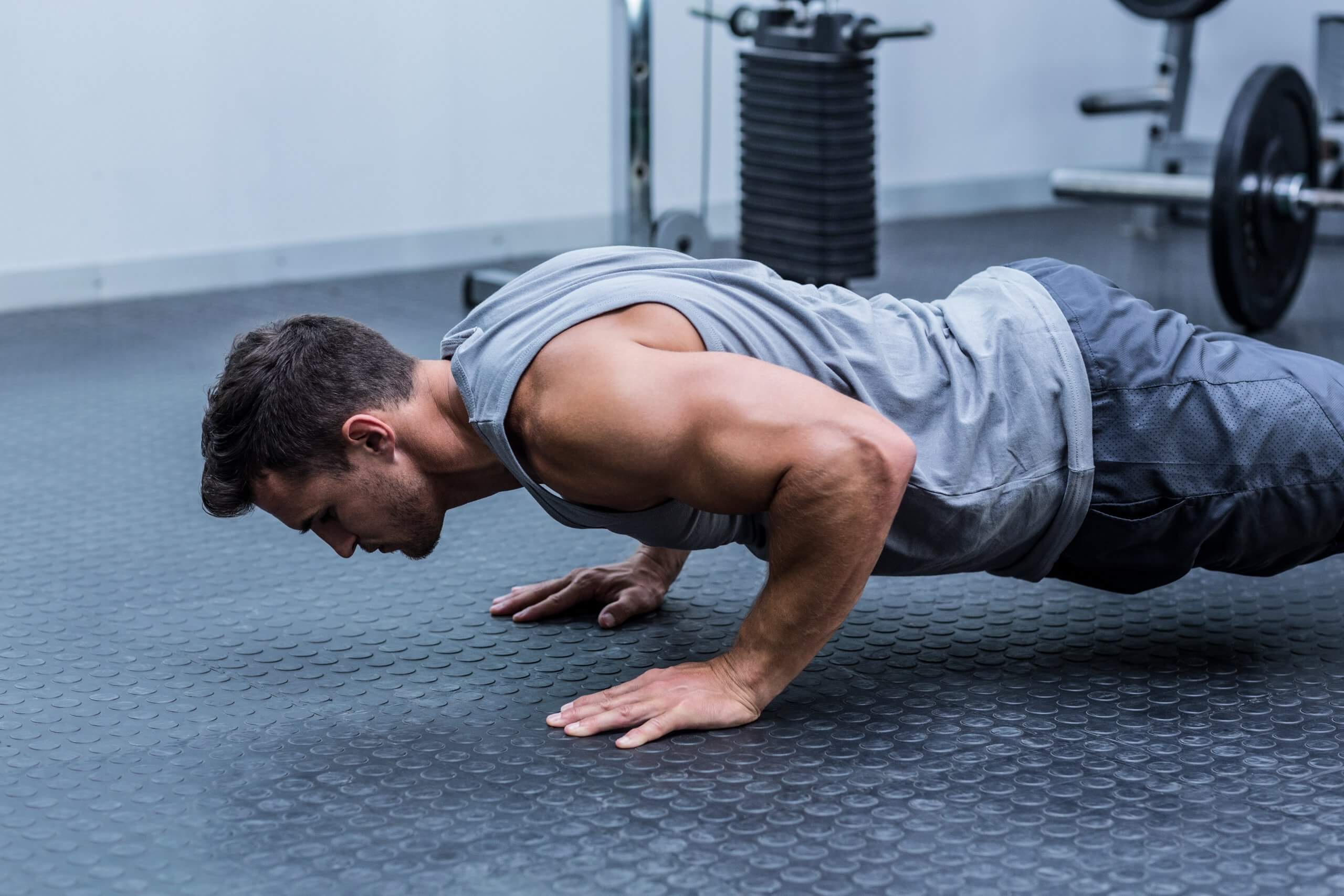 A,Muscular,Man,Doing,A,Pushups,At,The,Crossfit,Gym